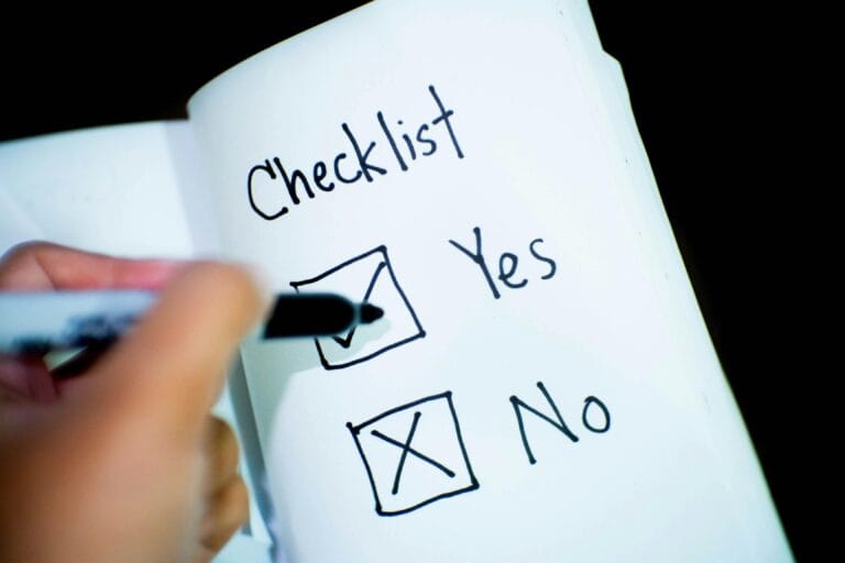 Is FlexJobs a Scam? Honest Review + Safety Guide A notebook featuring a checklist with a marked 'Yes' box, captured in a close-up shot.